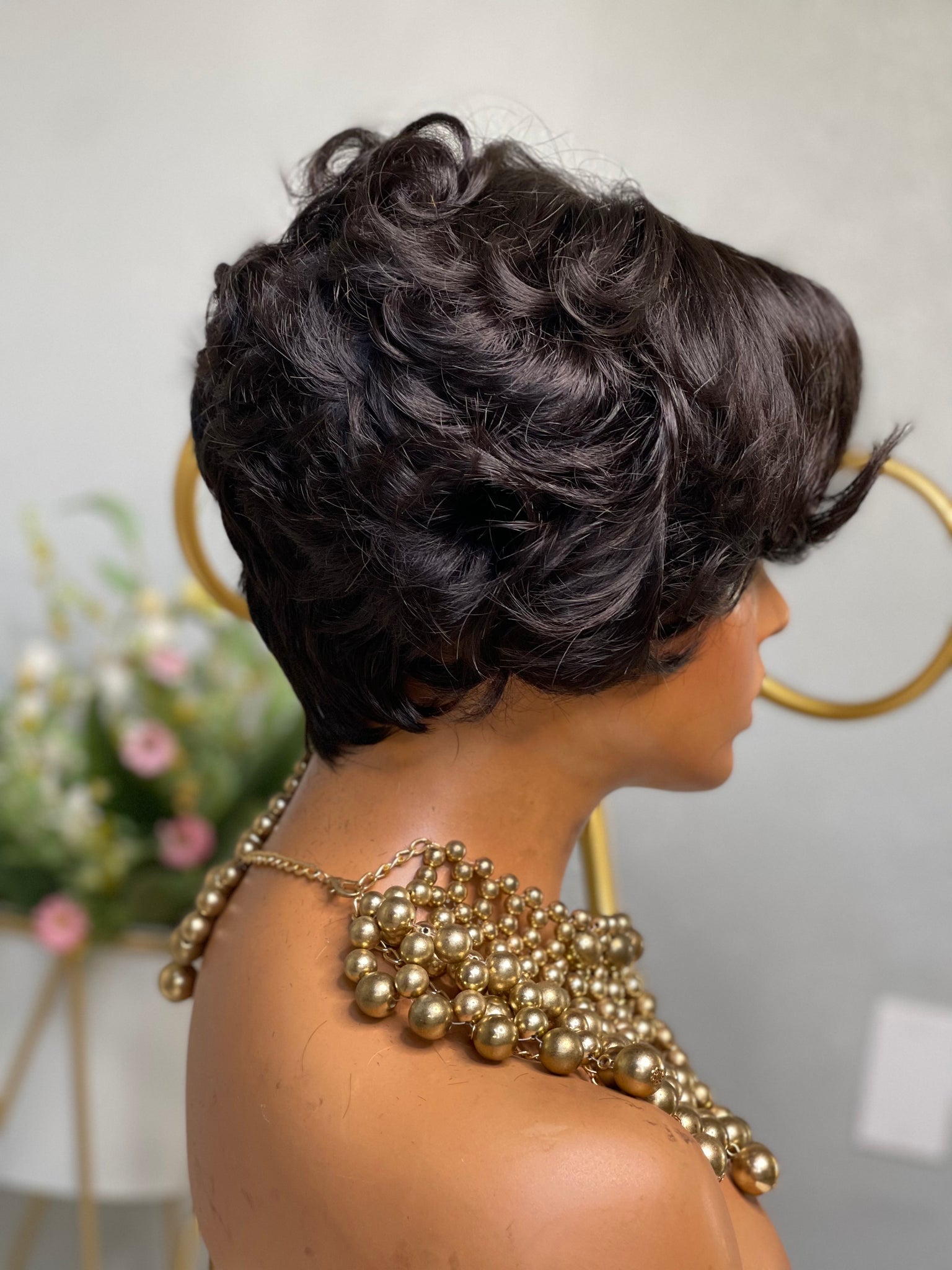 Glueless pixie cut wig with soft waves, creating an elegant yet playful look for Black women