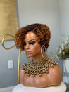 Short glueless pixie wig with highlights, adding warmth and dimension for African American hair.