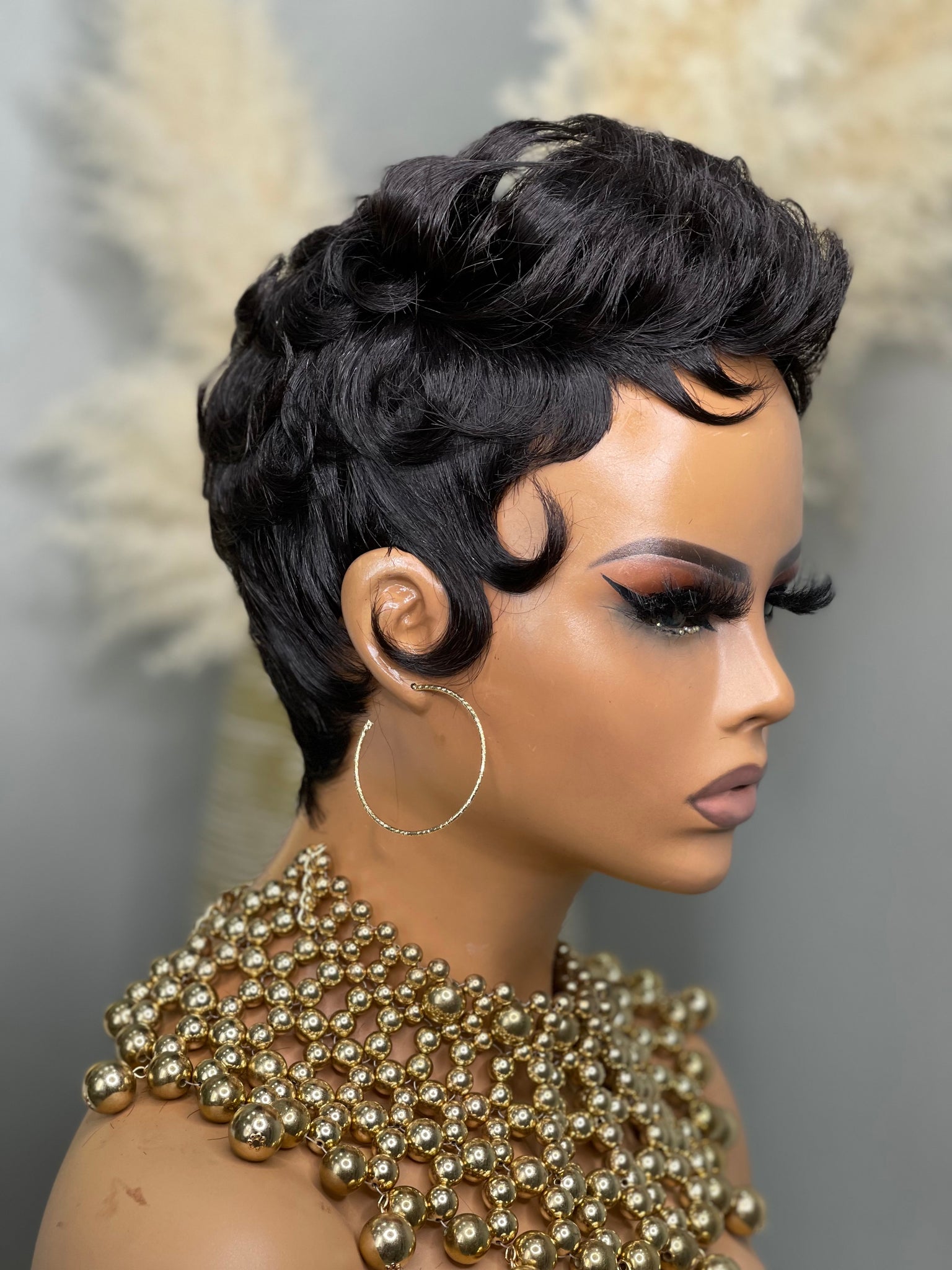 Glueless brunette pixie wig, offering a deep, natural shade for African American women.