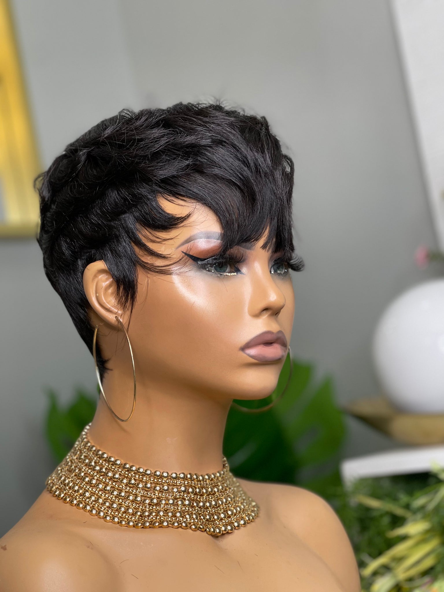 Glueless pixie cut wig with soft waves, creating an elegant yet playful look for Black women.