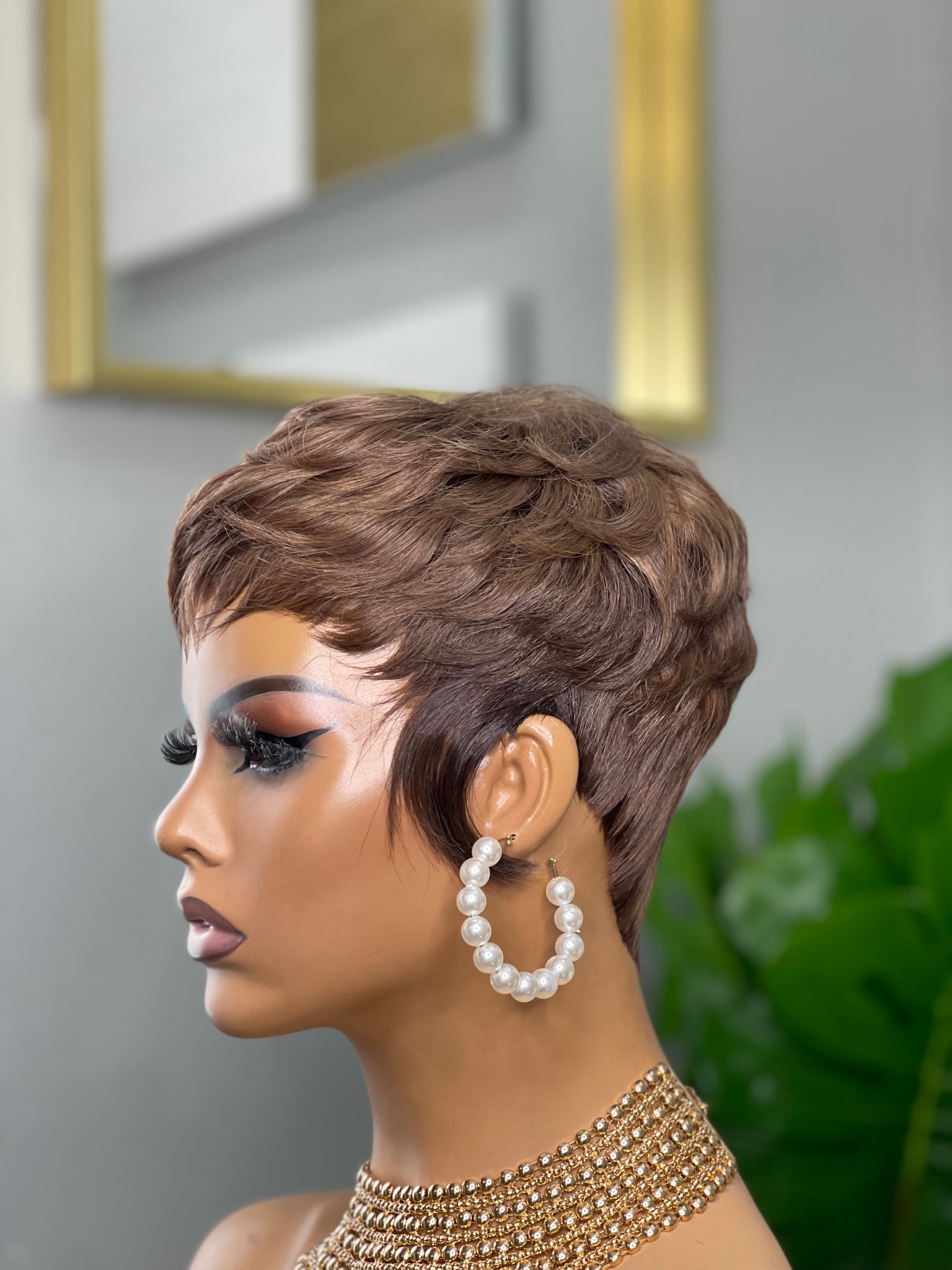 Glueless feathered pixie cut wig in black hair, providing a soft and feathered style for Black women.
