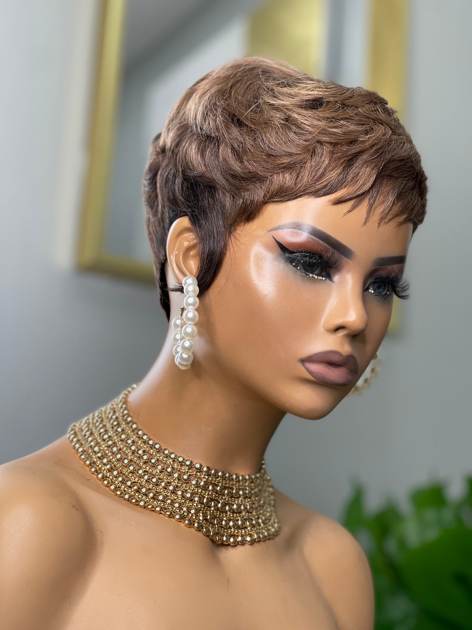 Glueless feathered pixie cut wig in black hair, providing a soft and feathered style for Black women.