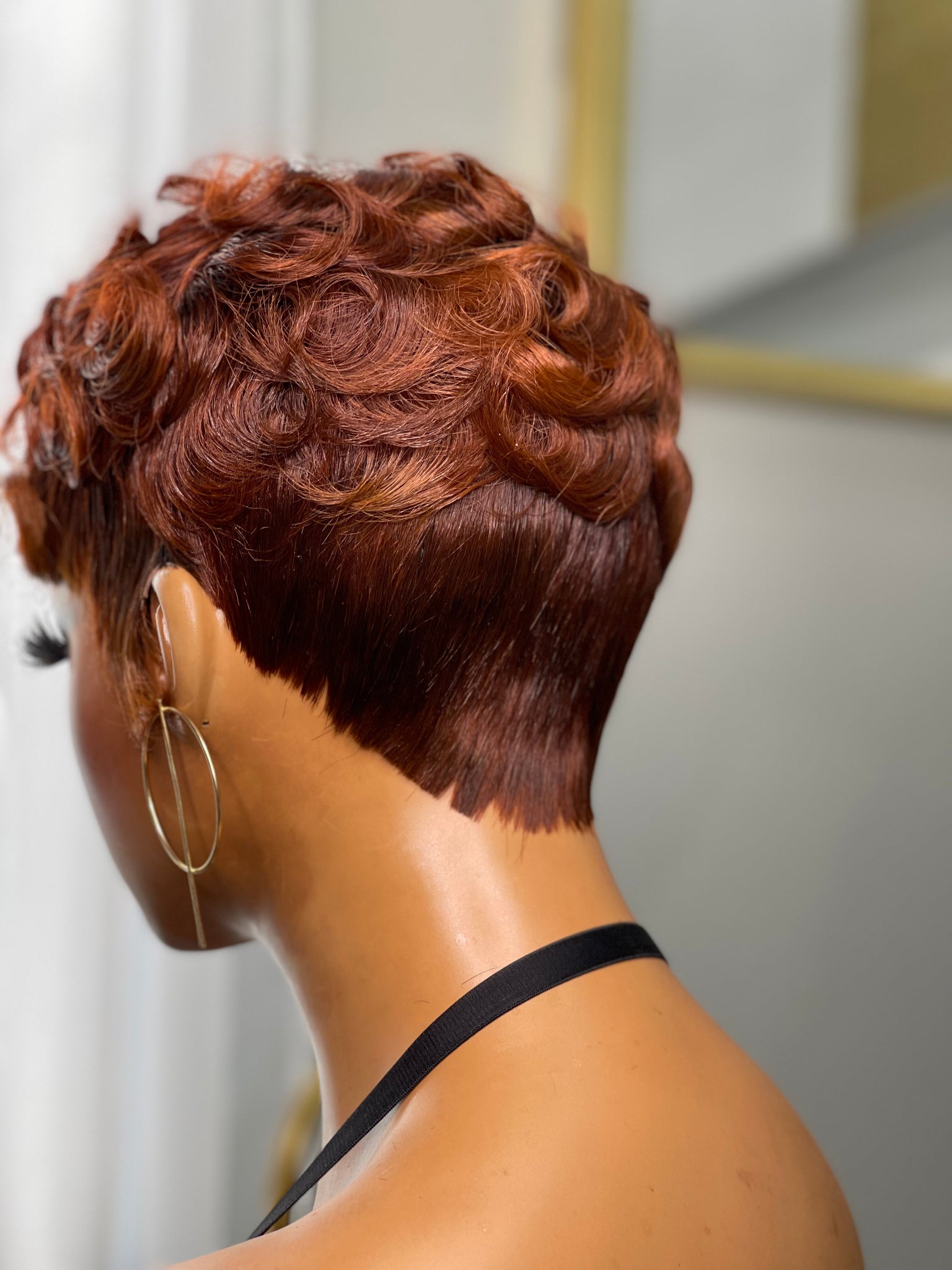 Glueless red pixie wig, a vibrant and stylish choice for African American women.