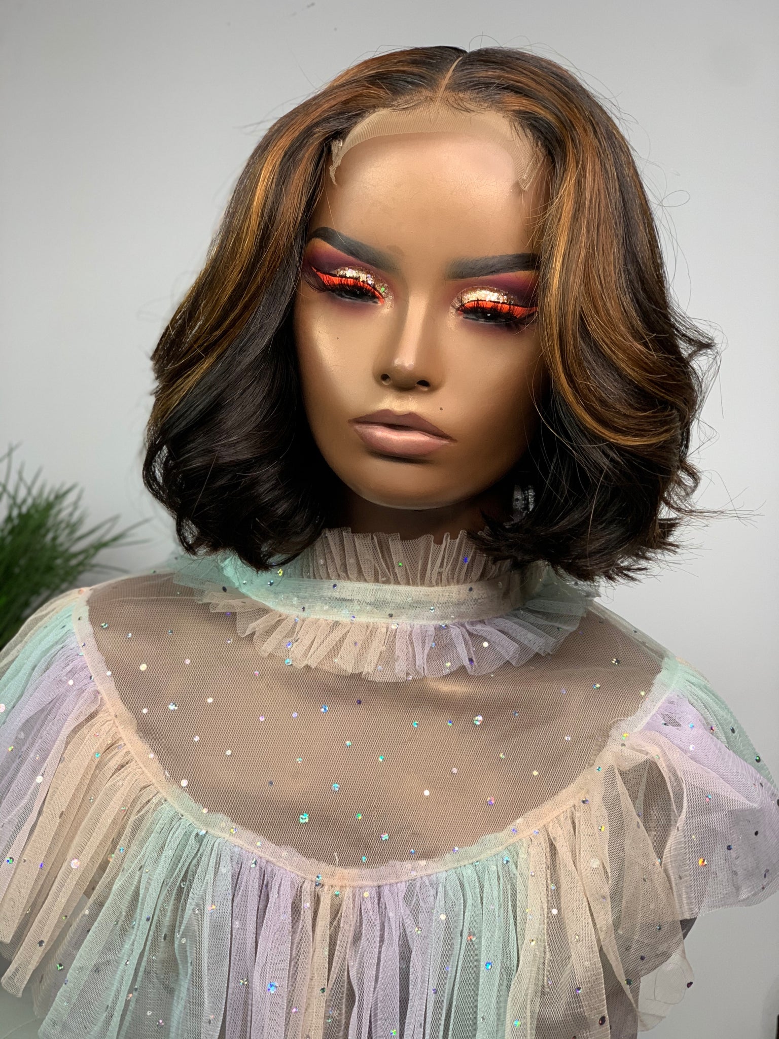 Short glueless bob wig with a soft curl pattern for a feminine look.