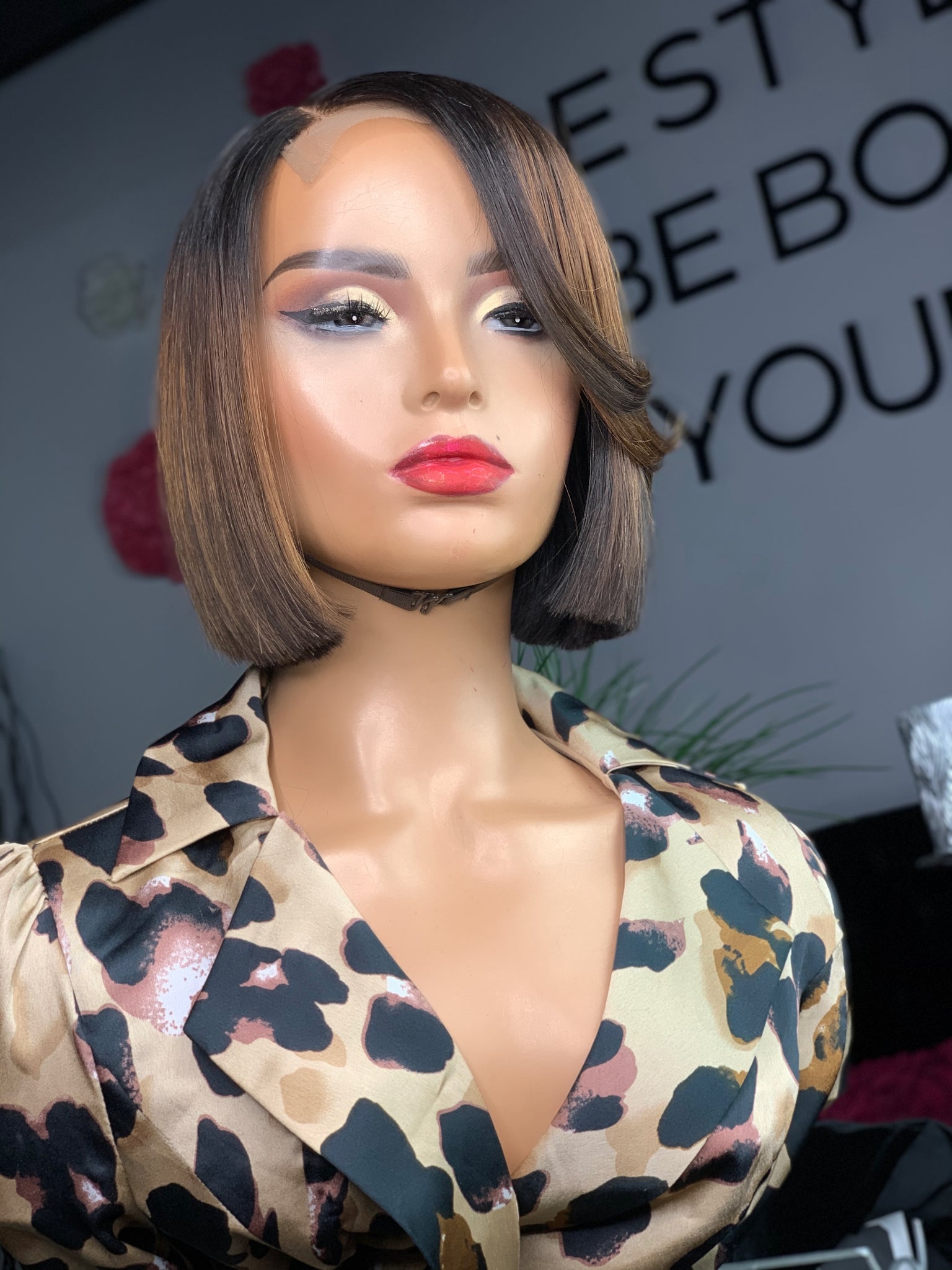 Short glueless bob wig with a soft curl pattern for a feminine look.